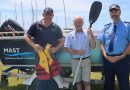 MAST ambassador Andrew Hart, MAST manager of recreational boating Peter Hopkins and Tasmania Police acting Inspector for Marine and Rescue Services Justin Lawson standing in front of a boat.
